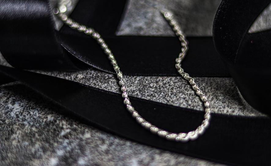 A 925 Italy chain with a black ribbon