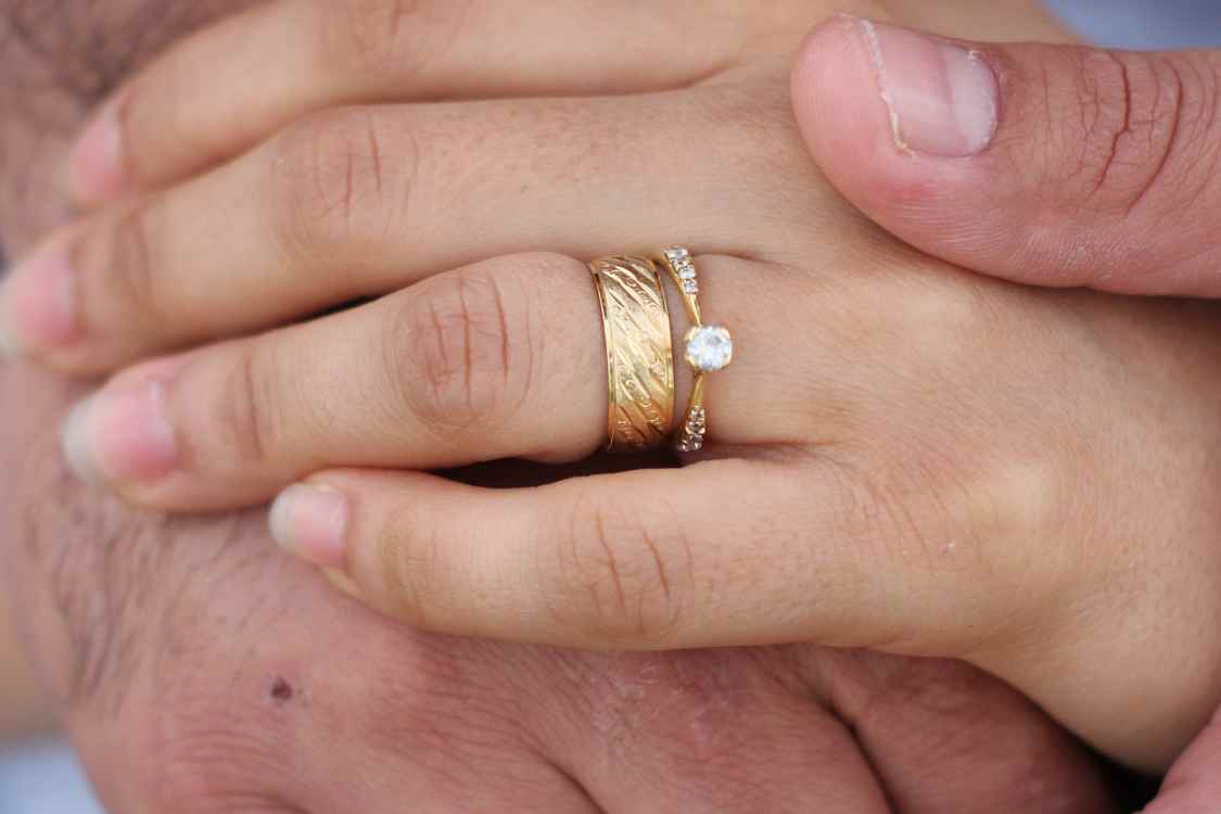 engagement ring and wedding band on same finger